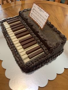 a sheet cake sitting on top of a wooden table covered in chocolate and music notes