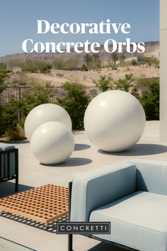 the cover of an article about decorative concrete orbs, with two chairs and a table