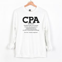 CPA Shirt, Spreadsheet Shirt, Accountant Gift, Excel Spreadsheet, Gift For Actuary, Accountant Shirt, Crewneck Sweatshirt Let's define a CPA. Magician, wizard, will we ever know? Why not shout it from your shirt any day of the week. Ideal for any situation, this sweatshirt is a heavy blend crewneck full of pure comfort, not to mention the style. Made from polyester and cotton, this sweatshirt will become a fan favorite.  How to order: 1. Please check and review all photos.  2. Choose your shirt Accounting Shirts, Cute Winter Sweaters, Accountant Gifts, The Office Shirts, Excel Spreadsheets, Dog Mom Gifts, Valentines Day Shirts, Christmas Shirts, Crewneck Sweatshirt