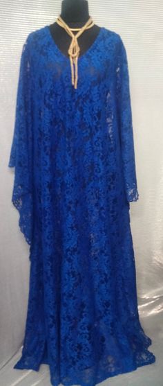 Floor length lace kaftan Comes with a matching scarf and camisole One size fits all( fits up to size 26) Electric blue color Blue Lace Maxi Dress With Lace Trim, Floor-length Lace Dresses For Eid, Elegant Lace Maxi Kaftan, Festive Lace Maxi Dress, Blue Lace Long Sleeve Maxi Dress, Blue Lace Maxi Dress With Long Sleeves, Blue Long Sleeve Lace Maxi Dress, Elegant Long Lace Kaftan, Lace Dress With Lace Work For Eid