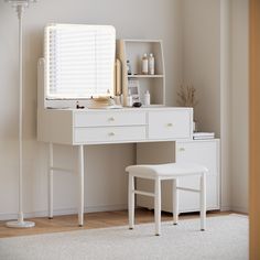 a white desk with a mirror, stool and shelf on top of it in a room