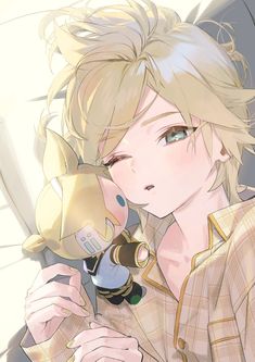 an anime character with blonde hair and blue eyes holding a cell phone to his ear