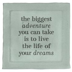 an embroidered quote on a white cloth with black lettering that reads, the biggest adventure you can take is to live the life of your dreams