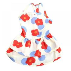 a white dress with red and blue flowers on it's chest, sitting against a white background