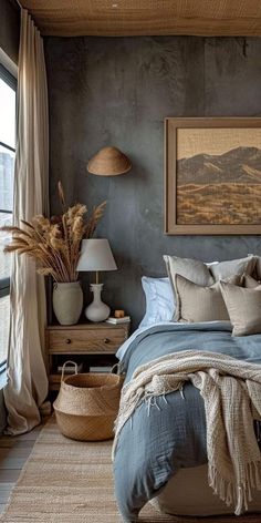 a bedroom with a bed, two lamps and pictures on the wall