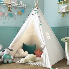 a child's teepee with stuffed animals around it