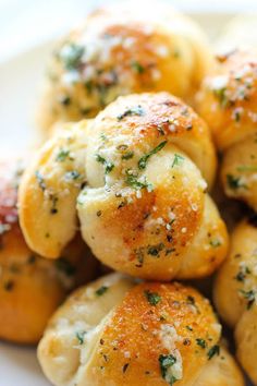 closeup of bread with herbs on it and cheese sprinkled over the top