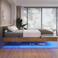 a bedroom with a bed and blue lights on the floor in front of a window