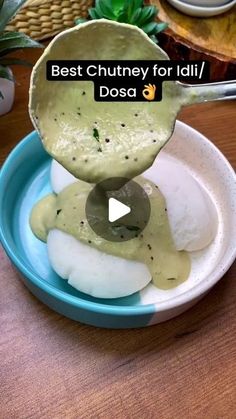 a bowl filled with food on top of a wooden table