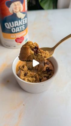 a bowl of oatmeal with a spoon in it