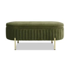 a green velvet bench with gold legs