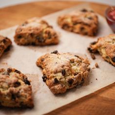 chocolate chip cookies sitting on top of a wooden table