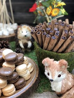 an assortment of cookies and pastries are on display in front of other items that include fake animals