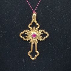 Vintage 18K Yellow Gold Ruby Cross Pendant. Marked 18 loop. Ruby is 2mm. Weighs 2.3 dwt. Are these stones real or fake? Aside from diamonds, we do not know if any gemstones are natural or synthetic. We will state on certain gemstones, that we know 100%, if they are created or fake due to their lack of inclusions. For this reason, we do not sell any diamonds without inclusions, and the larger diamonds (half ct+) are soft graded. In recent years, synthetic gemstones are being created to pass the hardness tests, which is why we state clear rubies and emeralds to be created.  In regards to Star Sapphires, typically, a genuine Star Sapphire's star will follow a light source that is shining on it, while created ones stay stationary. In recent years synthetic ones can now also follow the light so Spiritual Yellow Gold Jewelry With Diamond Cut, Luxury 22k Gold Jewelry Stamped 14k, Gold Diamond Cut Cross Pendant Jewelry, Elegant Gold Cross Pendant Jewelry, Victorian Hallmarked Cross Pendant Jewelry, Spiritual 22k Yellow Gold Jewelry, Antique Yellow Gold Diamond Jewelry, Yellow Gold Ruby Jewelry Stamped 14k, Luxury Yellow Gold Cross Pendant Jewelry