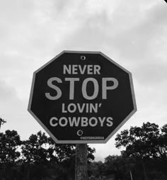 a black and white photo of a stop sign with the words never stop lovin'cowboys written on it