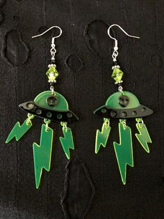 These lightweight a acrylic alien earrings are perfect for anyone who loves rave wear as they'd look great in black light race rooms  Perfect for any alien lover  Sterling silver hook Space Themed Accessories, Aliencore Outfit, Alien Aesthetic Outfit, Rave Earrings, Alien Accessories, Alien Clothing, Alien Outfit, Alien Decor, Alien Jewelry