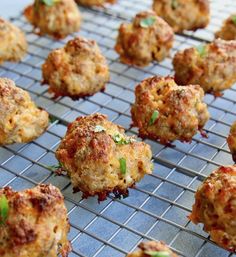 some meatballs are on a cooling rack and ready to be cooked in the oven