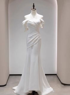 a white dress on display in a room