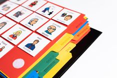 a stack of colorful folders with pictures of people and words on them, all in different colors