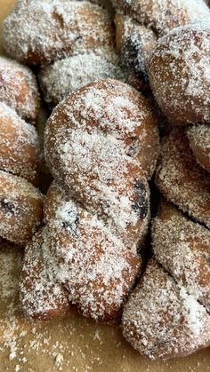 powdered sugar covered pastries are piled on top of each other