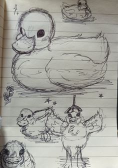 a drawing of two ducks and one duckling with stars on their head, sitting in front of a sheet of lined paper