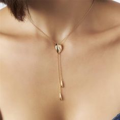 Introducing our 18K Gold-Plated Tie Necklace with Zirconias — a statement of refined elegance and timeless glamour. Versatile and chic, this piece effortlessly elevates any ensemble, making it the perfect accessory for both casual and formal occasions. 15.75in + 2in extender 40CM + 5CM Luxury White Lariat Necklace For Gift, Elegant Rose Gold Chain Necklace For Formal Events, Elegant Formal Chain Necklace With Adjustable Chain, Elegant Teardrop Pendant Drop Necklace, Elegant Pendant Chain Necklace For Wedding, Elegant Wedding Pendant Chain Necklace, Elegant Long Lariat Necklace For Formal Occasions, Gold-tone Clavicle Chain Jewelry For Wedding, Modern Formal Necklaces With Elegant Design