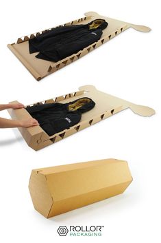 an open cardboard box with two pieces of clothing in it and the bottom one is empty