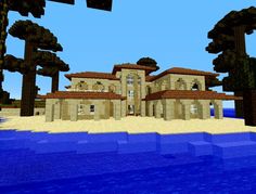 a large house sitting on top of a sandy beach next to the ocean in minecraft