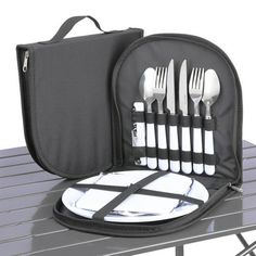 a lunch bag with utensils in it sitting on a table