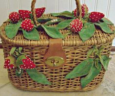 a wicker basket with red berries and green leaves