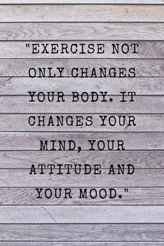 a wooden wall with a quote on it that says exercise not only changes your body, it changes your mind, your attitude and your mood