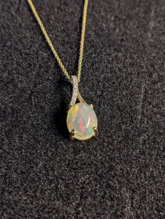 Pendants-Ethiopian Opal Pendant W All Natural Diamond Accents in 14k Solid Gold | Oval Shape | Jelly Opal | October Birthstone | Customizable - NNJGemstones Jelly Opal, Jewelry Appraisal, Birthstone Gifts, October Birthstone, Custom Jewelry Design, Natural Earth, Opal Pendants, October Birth Stone, White Rose Gold