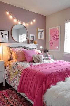 a bedroom decorated in pink, white and grey