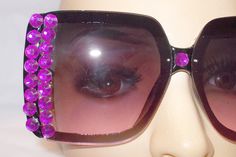 FABULOUS OVERSIZED SQUARE SUNGLASSES! THESE BEAUTIES ARE A PURPLE FRAME.  THE LENS ARE PURPLE. THE DOUBLE ROW OF LARGE RHINESTONES ARE PURPLE. THE GLASSES MEASURE APPROX. 6" BY 2.5". INCLUDED IN THE SALE WILL BE A GLASSES POUCH, SPARE RHINESTONES, AND FREE US SHIPPING! THESE GLASSES ARE ALL HAND DECORATED, SO NO TWO ARE THE SAME. Please confirm that these items will fit properly, as I prefer not to process any returns. If a return is necessary, please note that the buyer will be responsible for Purple Frame, Glasses Pouch, Oversized Square Sunglasses, Unique Sunglasses, Unique Boutique, Shape And Form, Purple Crystals, Hand Decorated, Eyewear Sunglasses