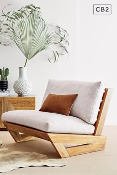 a living room with white walls and wooden furniture