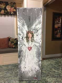 an angel painted on the side of a refrigerator