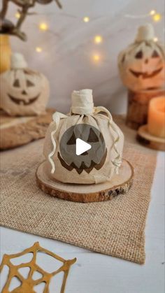 a video demonstrating how to decorate pumpkins on wood slices with string lights in the background