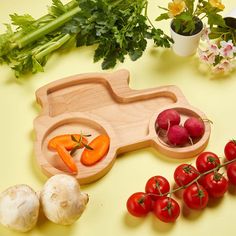 vegetables and fruits are arranged on a yellow surface