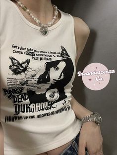 Our Grunge Y2K Tank Top is comfy and eye catching.  This Graphic Tank can be dressed up or down, depending on the occasion or outfit! This Y2K inspired Grunge Tank would make the perfect gift or personal spoil! This tank is a classic basic with a twist! Order yours today to elevate your wardrobe. Thank you for shopping with us!💕 Lots and lots of love Incandescenza Co✨💋  http://incandescenzaco.etsy.com/ ➡️ for more options 💗  -------------- PLEASE CONTACT ME IF YOU HAVE ANY QUESTIONS --------- Trendy Graphic Print Crew Neck Tank Top, Y2k Printed Streetwear Tops, Y2k Printed Tops For Streetwear, Fitted Punk Tops With Graphic Design, Grunge Crew Neck Tank Top With Letter Print, Grunge Cotton Tops With Front Print, Punk Style Printed Cotton Tops, Punk Style Graphic Print Cotton Tops, Punk Style Cotton Tops With Graphic Print