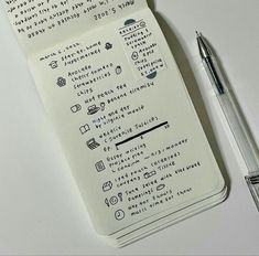 a notepad with writing on it next to a pen