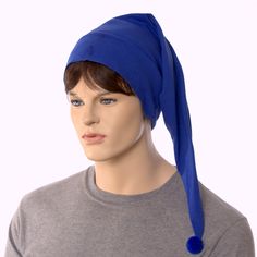 a mannequin head wearing a blue turban and grey t - shirt