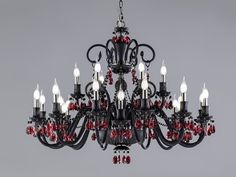 a black chandelier with red and white crystals