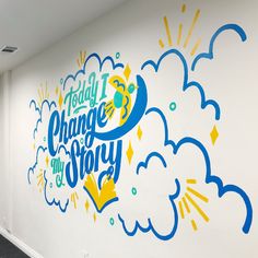 an office hallway painted with the words today i change my story on it's wall