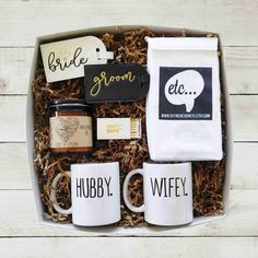 coffee mugs and personal items in a gift box