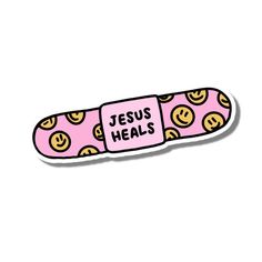 a pink sticker that says jesus heals with emoticions and smiley faces on it