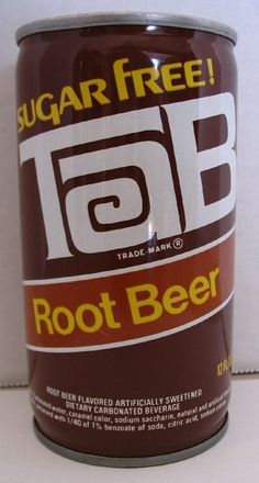 a can of root beer sitting on top of a white counter next to a wall