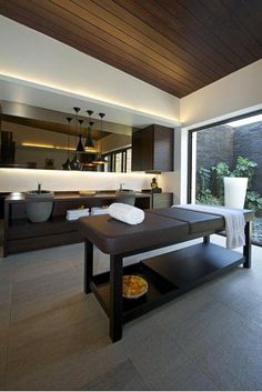 a spa room with a large window overlooking the outside