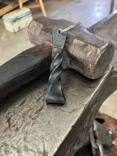 an old hammer and some nails on a bench