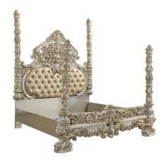 a white bed with gold headboard and foot board on it's sides, sitting in front of a white background