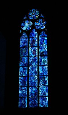 a stained glass window with flowers on it